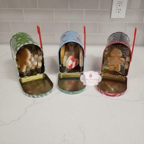Three small canisters with decorative lids on a pink surface, featuring a brand logo in the center.